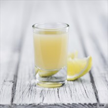 Fresh made Juice (lemon) on a vintage background (close-up shot)