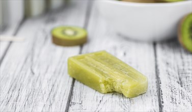 Kiwi Popsicles (fresh) as detailed close-up shot, selective focus)