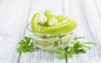 Some homemade Green Chilis (filled with cheese) (selective focus) as detailed close-up shot