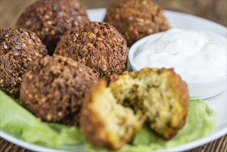 Falafel (close-up shot, selective focus) on an old wooden table