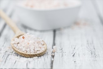 Pink Salt on a vintage background as detailed close-up shot (selective focus)