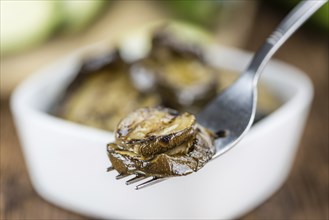 Homemade Antipasti (Grilled Zucchinis) on vintage background (selective focus, close-up shot)