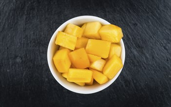 Portion of fresh made Kaki fruits (close-up shot, selective focus)