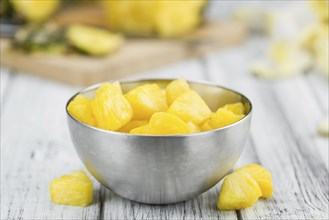 Fresh made Pineapple (sliced) on a vintage background as detailed close-up shot