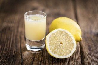 Fresh made Juice (lemon) on a vintage background (close-up shot)