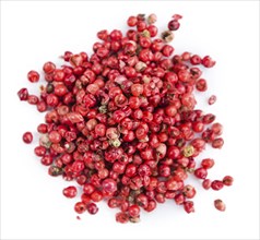 Fresh Pink Peppercorns isolated on white background, close-up shot