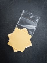 Sliced Cheese on a vintage background as detailed close-up shot (selective focus)