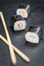 Fresh made Sushi (selective focus) on a vintage looking slate slab