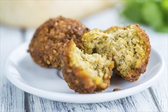 Falafel (close-up shot, selective focus) on an old wooden table