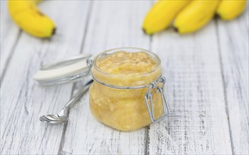 Mashed Bananas (selective focus, close-up shot) on a vintage background