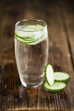 Cucumber Water on a vintage background as detailed close-up shot, selective focus