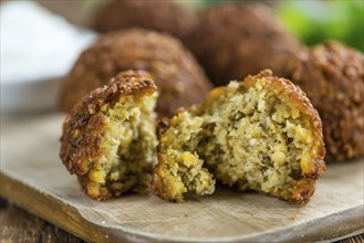 Falafel (close-up shot, selective focus) on an old wooden table