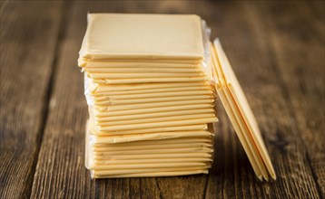 Sliced Cheese on a vintage background as detailed close-up shot (selective focus)