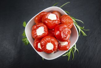 Homemade Filled Pimientos on vintage background (selective focus, close-up shot)