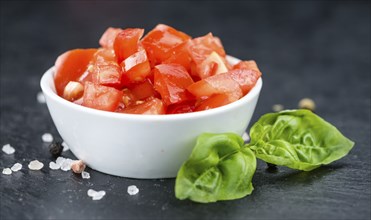 Homemade Cutted Tomatoes on vintage background (selective focus, close-up shot)