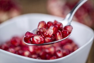 Portion of Pomegranate seeds (close-up shot, selective focus)