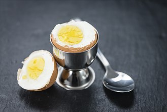 Slate slab with boiled Eggs (selective focus, close-up shot)