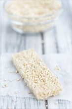 Fresh made Quinoa Bars (selective focus, close-up shot) on an old wooden table