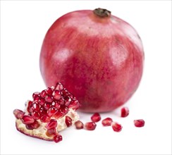 Portion of Pomegranate (as close-up shot) isolated on white background