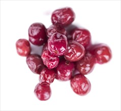 Preserved Cranberries as detailed close-up shot isolated on white background (selective focus)