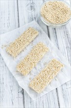 Some fresh made Quinoa Bars on vintage background (close-up shot)