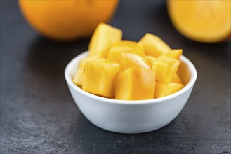 Portion of fresh made Kaki fruits (close-up shot, selective focus)