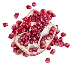 Portion of Pomegranate (as close-up shot) isolated on white background