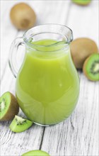 Fresh made Kiwi Smoothie (selective focus) on a vintage looking background