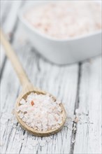 Pink Salt on a vintage background as detailed close-up shot (selective focus)