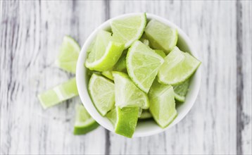 Portion of fresh Lime Slices (close-up shot, selective focus)