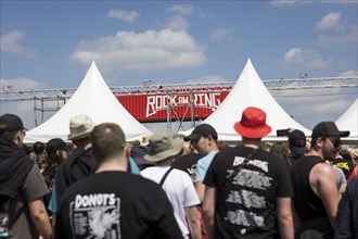 Festival visitors in front of the entrance to the infield at the Rock am Ring Festival, Nürburgring