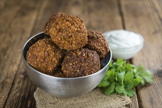 Falafel (close-up shot, selective focus) on an old wooden table