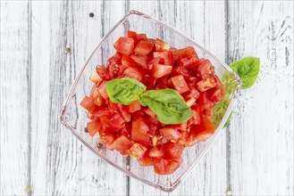 Homemade Cutted Tomatoes on vintage background (selective focus, close-up shot)