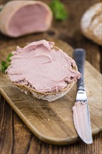 Fresh made Sandwich with Liverwurst on a vintage background (close-up shot)