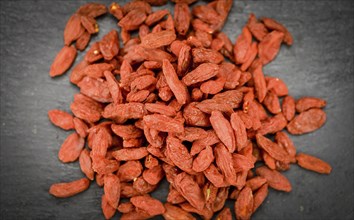 Goji Berries on a vintage background as detailed close-up shot (selective focus)