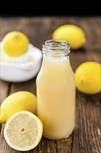 Lemon Juice on a vintage background as detailed close-up shot (selective focus)