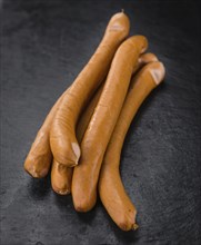 Wiener Sausages on a vintage background as detailed close-up shot (selective focus)