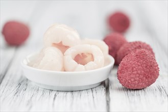 Fresh made Lychees (preserved) on a vintage background (close-up shot)