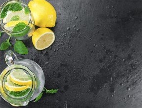 Homemade Lemonade on vintage background (selective focus, close-up shot)