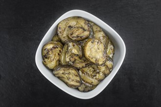 Homemade Antipasti (Grilled Zucchinis) on vintage background (selective focus, close-up shot)