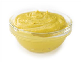 Portion of Mustard (as close-up shot) isolated on white background