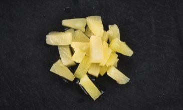 Portion of fresh Preserved Pineapple pieces close-up shot, selective focus