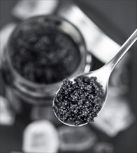 Portion of Black Caviar as detailed close-up shot, selective focus