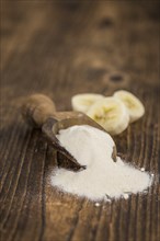 Portion of fresh Banana Powder close-up shot, selective focus