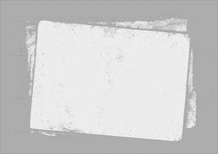 A blank vintage paper with a rough texture against a gray background, background image