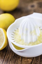 Lemon Juice on a vintage background as detailed close-up shot (selective focus)