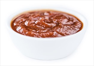 Tomato Ketchup isolated on white background (selective focus, close-up shot)