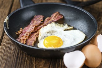 Portion of Bacon and Eggs (selective focus, close-up shot)