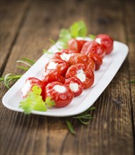 Some homemade Red Pepper (stuffed with cheese) (selective focus) as detailed close-up shot