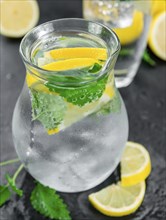 Some Lemonade (with Balm) on a slate slab (close-up shot, selective focus)